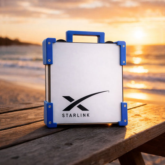 Blue Starlink Mini Magnetic Mount on timber table at Australian beach sunset - portable satellite dish carry frame by Dishy Mini Mounts
