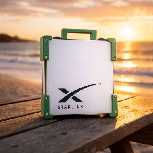 Green Starlink Mini Magnetic Mount on timber table at Australian beach sunset - portable satellite dish carry frame by Dishy Mini Mounts