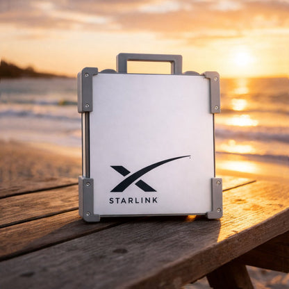 Grey Starlink Mini Magnetic Mount on timber table at Australian beach sunset - portable satellite dish carry frame by Dishy Mini Mounts