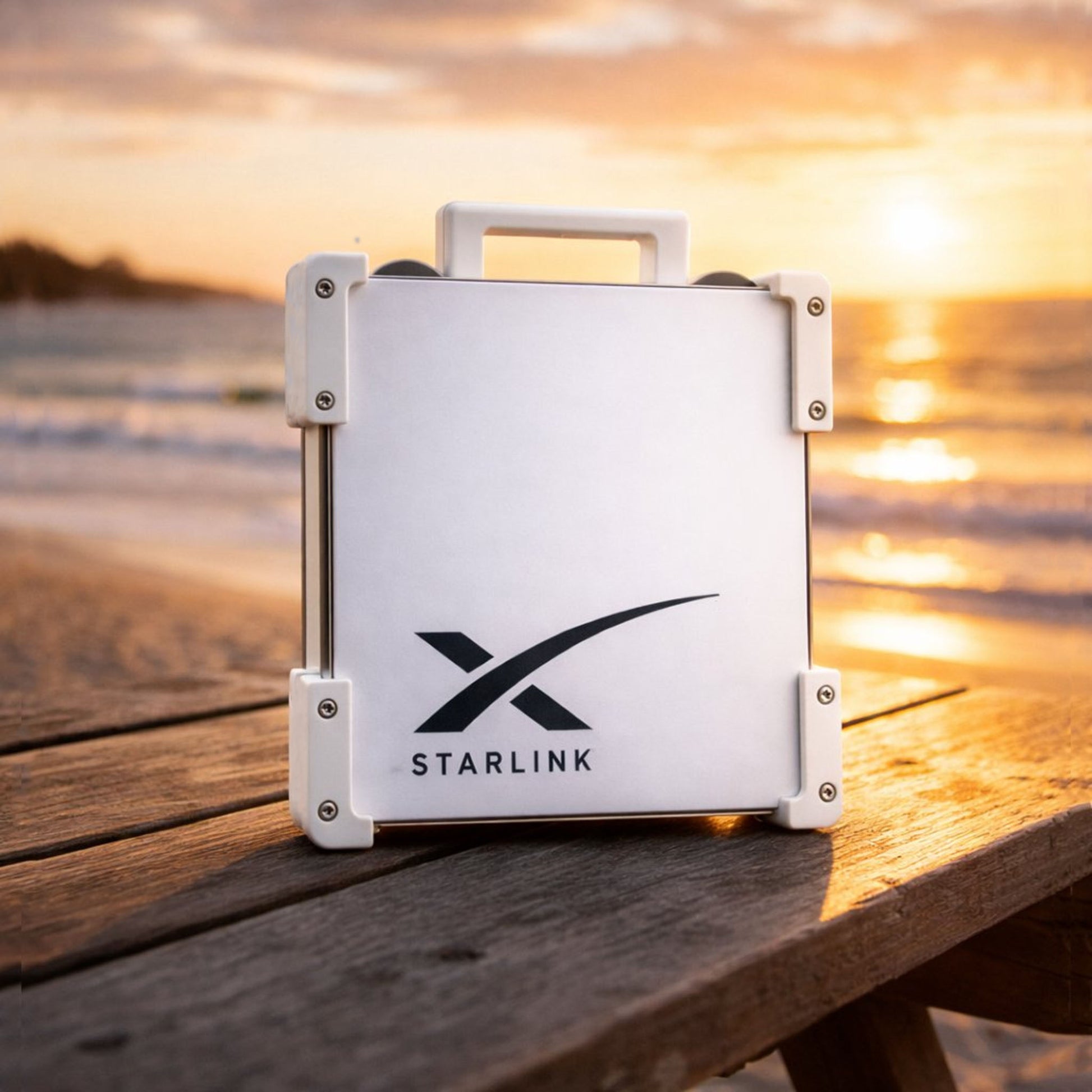 White Starlink Mini Magnetic Mount on timber table at Australian beach sunset - portable satellite dish carry frame by Dishy Mini Mounts
