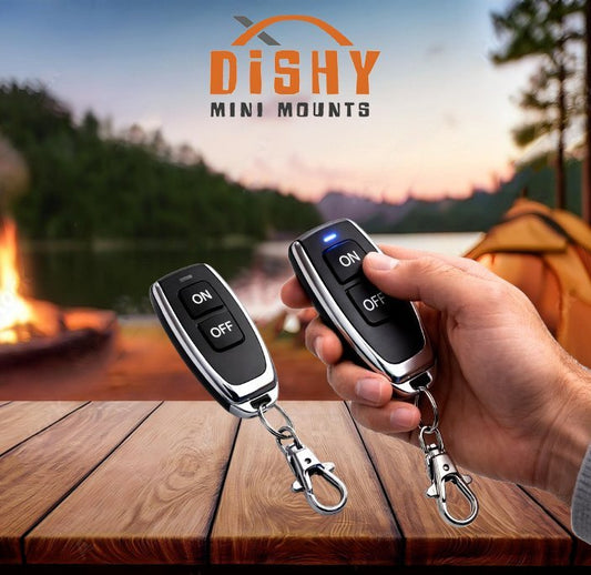 Hand holding two remote controls with 'DISHY Mini Mounts' branding against a camping background.